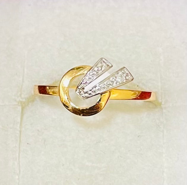 Bague en or jaune et blanc 18 carats sertie d'un diamant