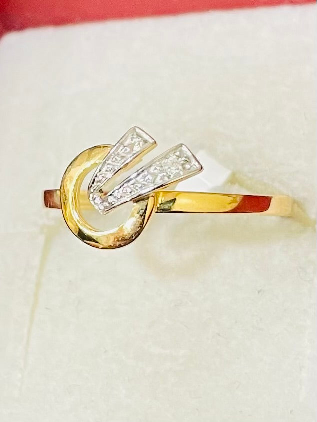 Bague en or jaune et blanc 18 carats sertie d'un diamant